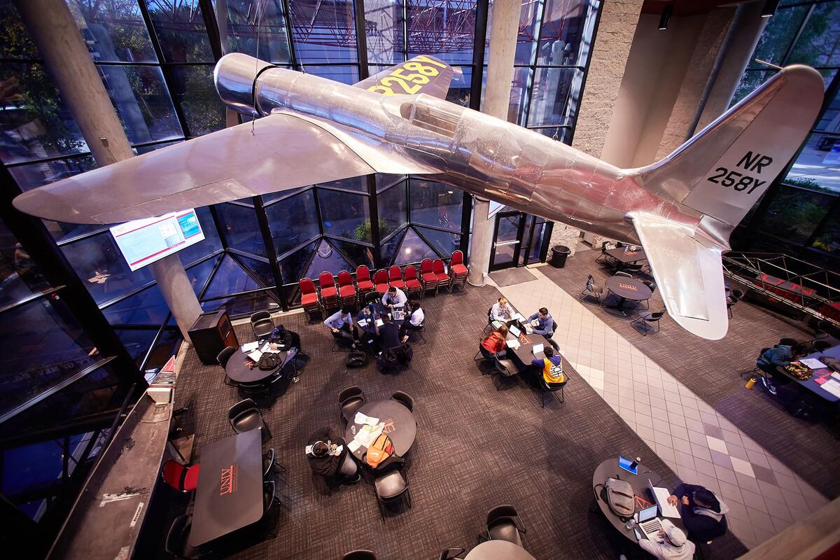 Airplane hanging in building lobby