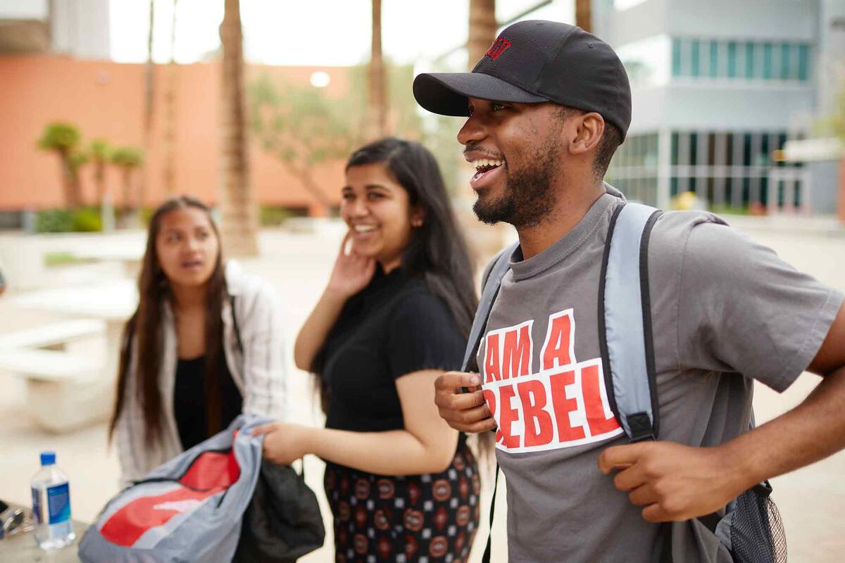 Hoffman Madzou smiles in a group of students.