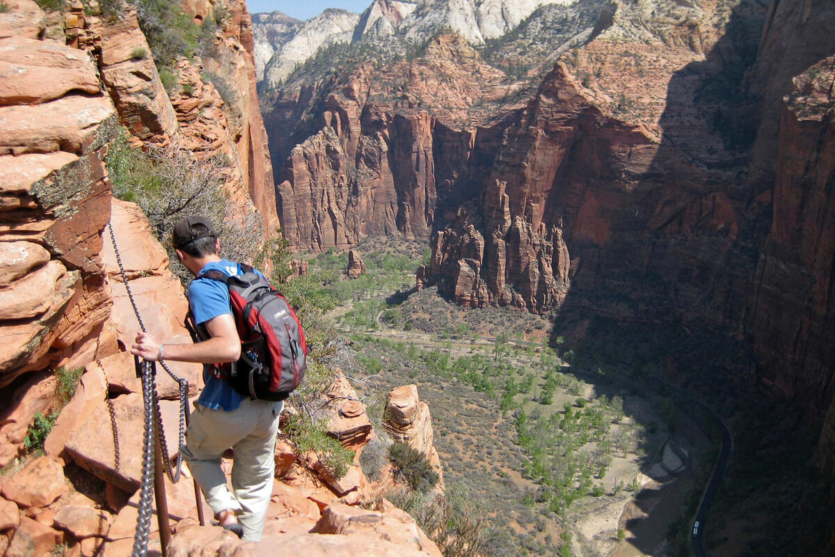A hiker descends the Angels Landing route in Zion National Park