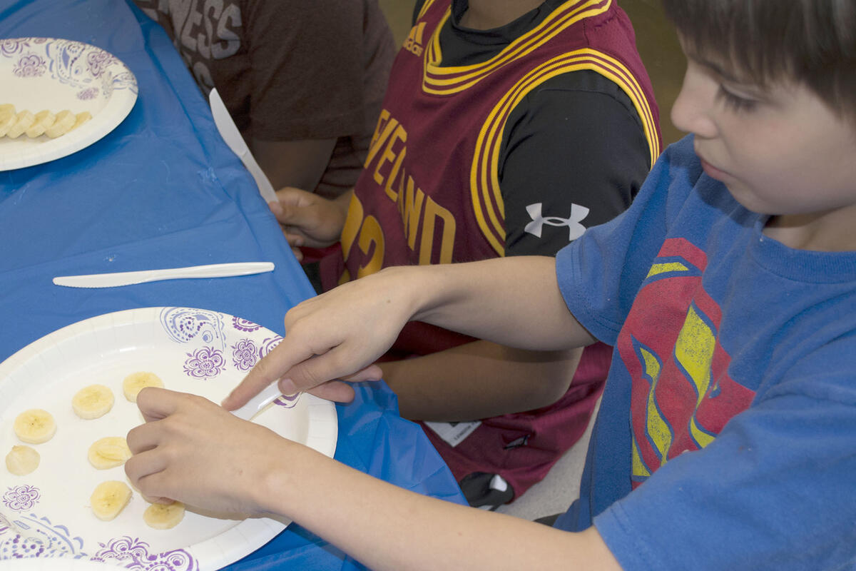 Elementary student learns proper food handling