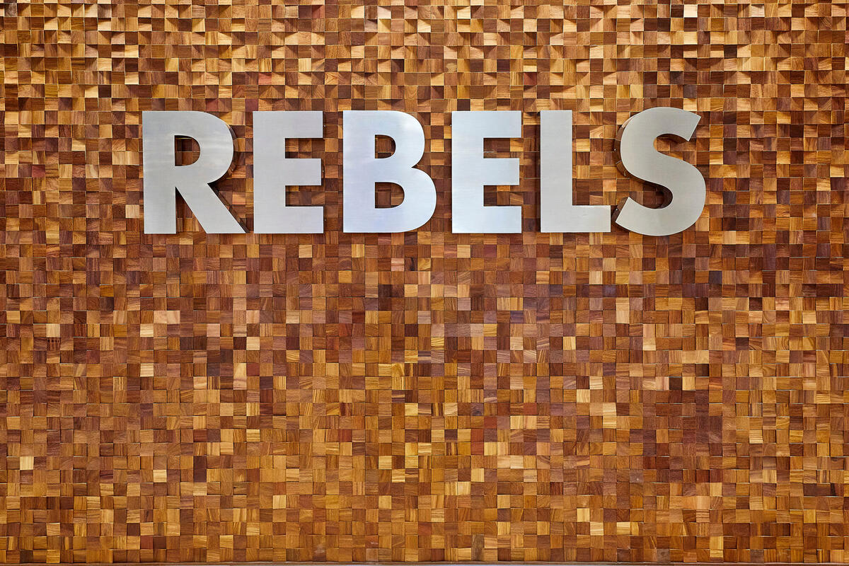 Silver Rebels letters on a golden wall