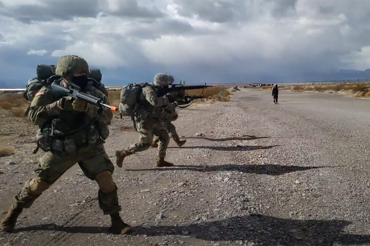 Soldiers running with their rifles