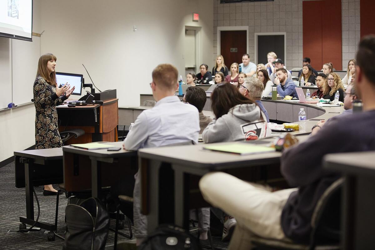 A student speaking in front of a class.