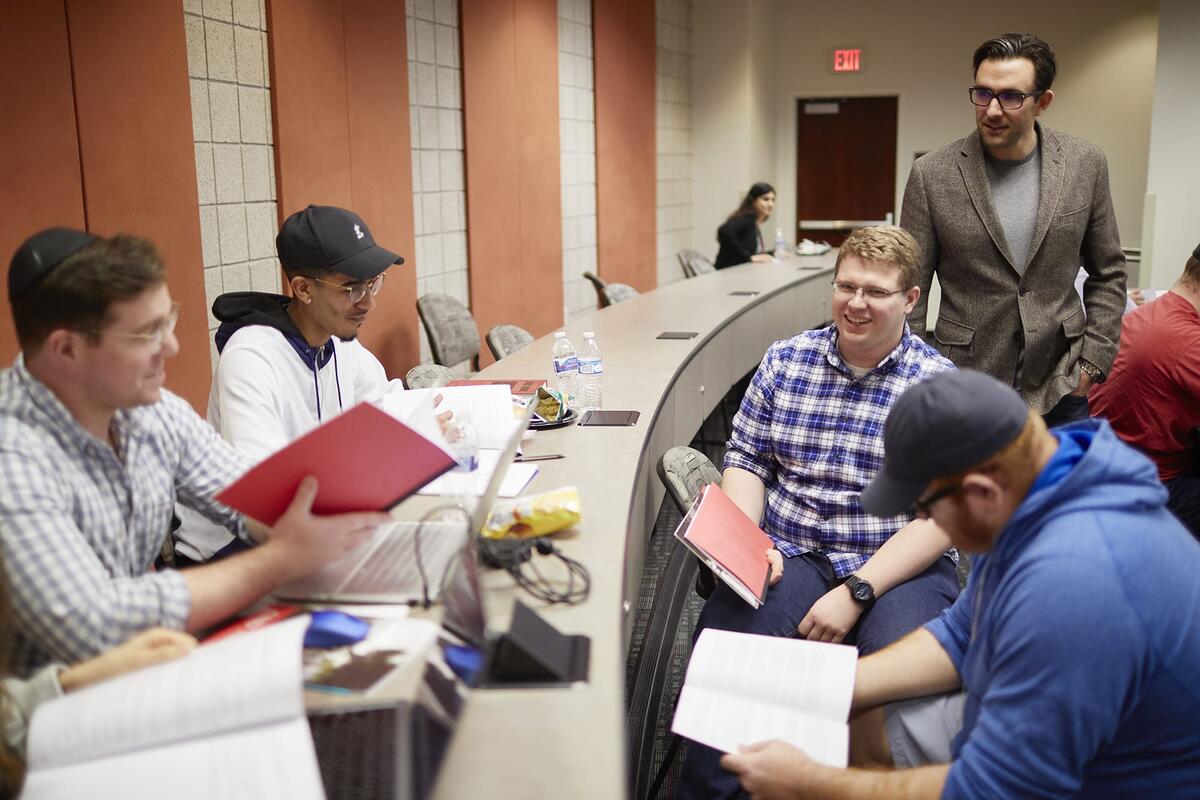 Students studying their notes together.