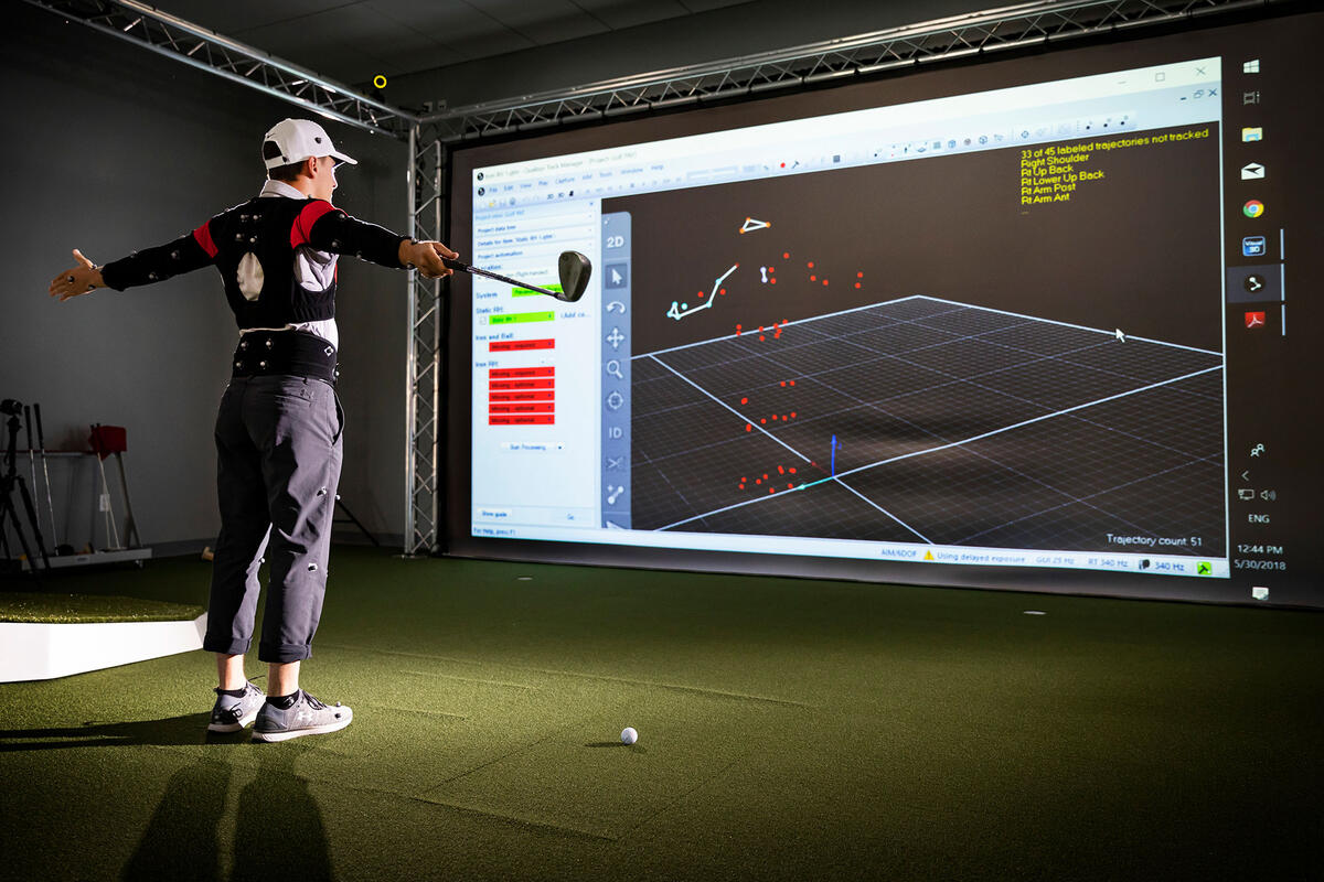 Golfer using a PGA 3D motion program