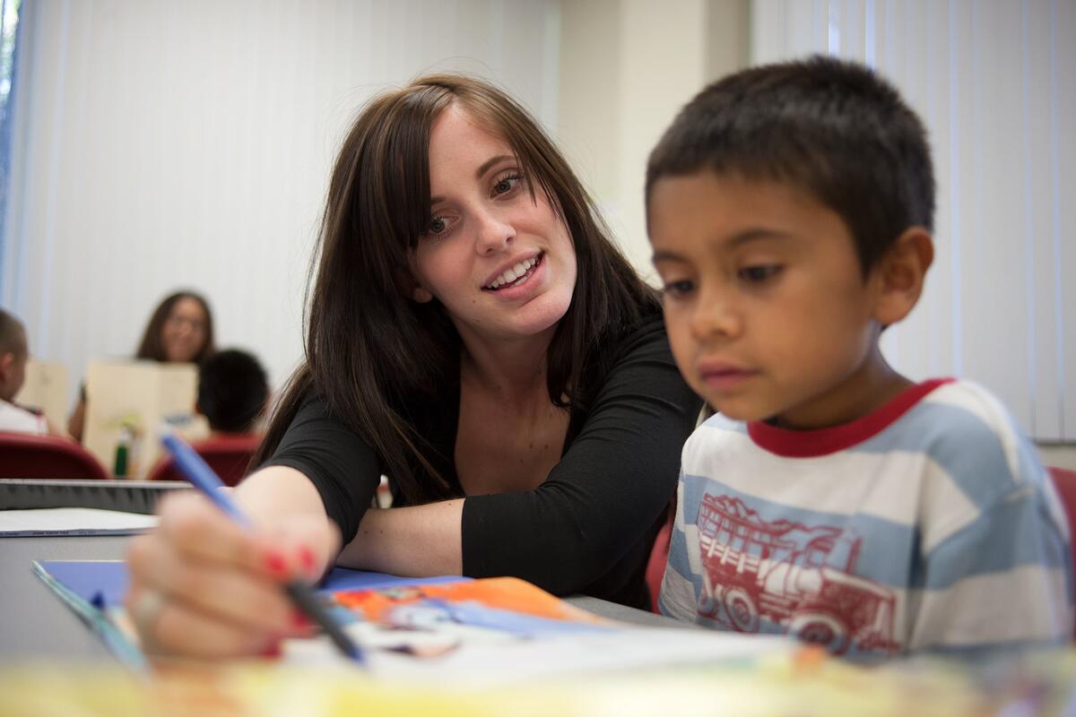 A UNLV student tutoring a child for experience.