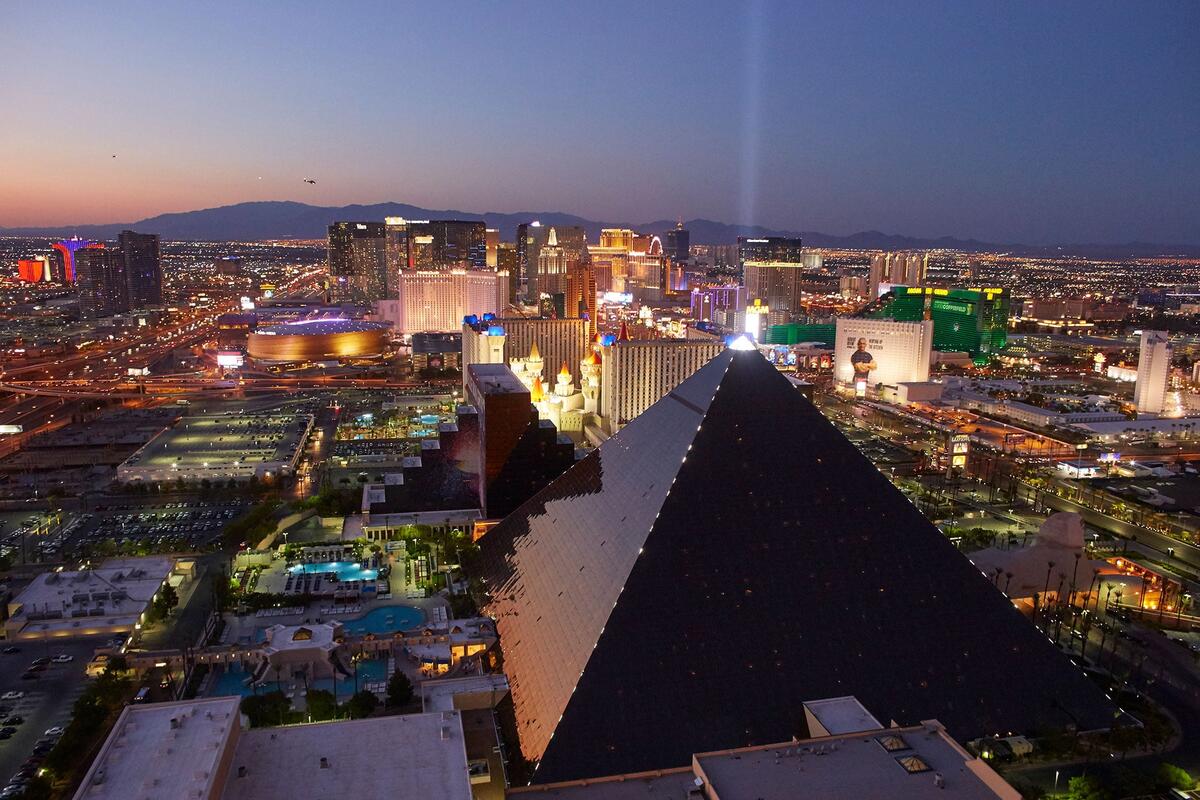 A view of the Las Vegas strip with the Luxor building lighting up the sky.