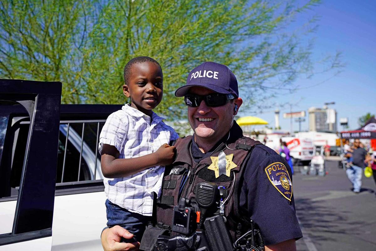 Officer holds child