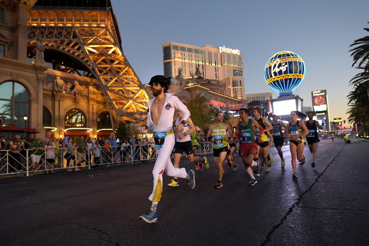 Man dressed in Elvis costume runs a race on the Las Vegas strip