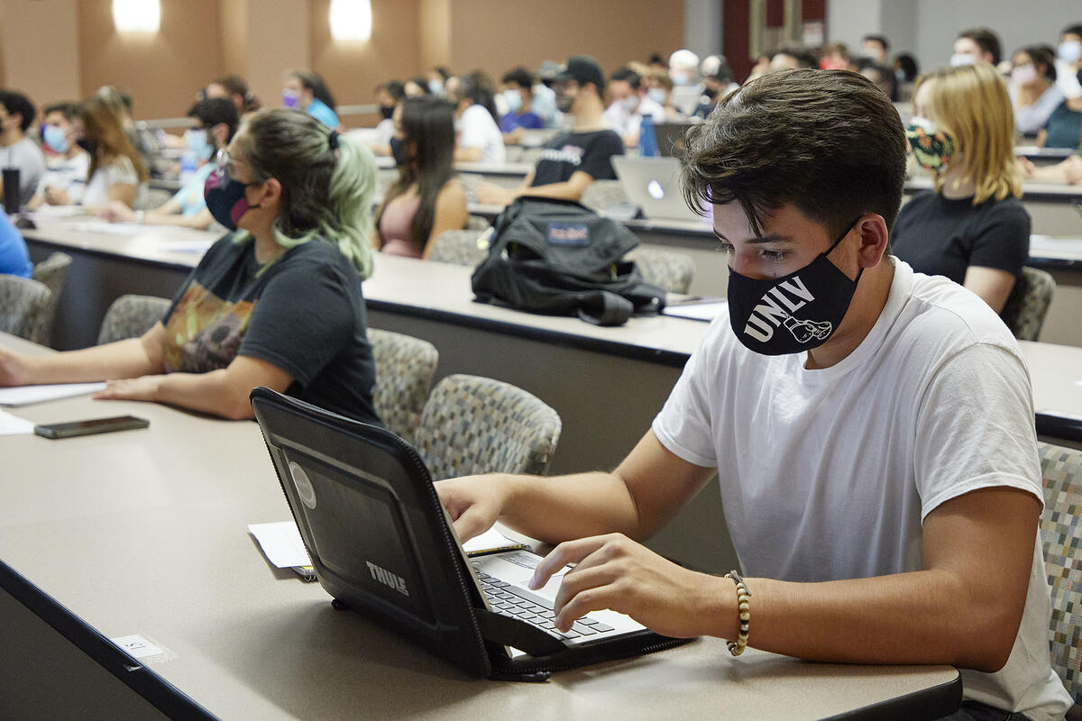 students in classroom socially distanced and masked