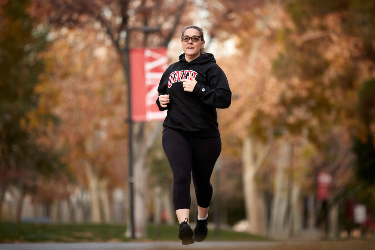 woman jogging on campus