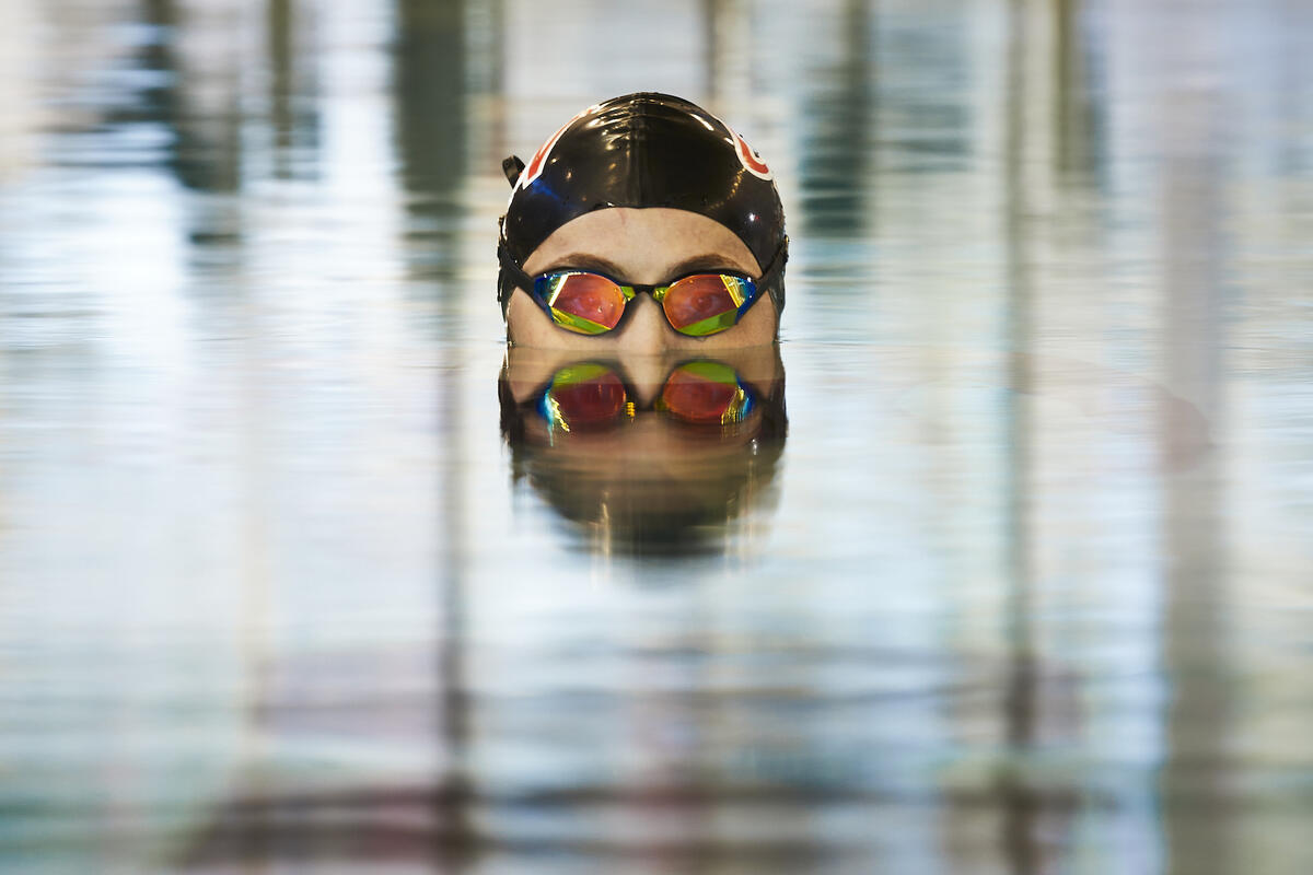 swimmer's head rising out of water