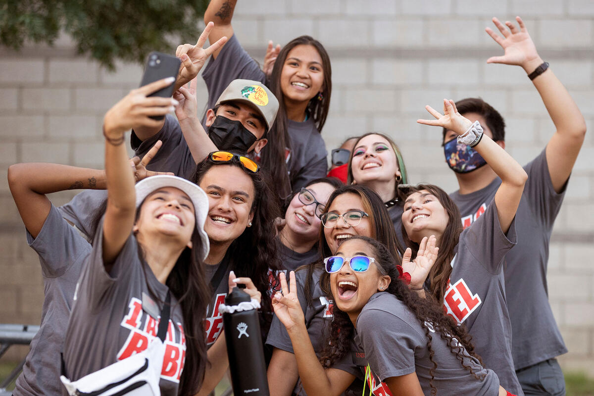 A group of students posing for a selfie picture together.
