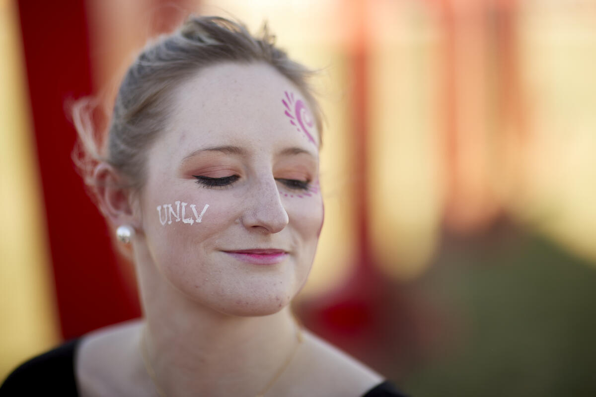 A Premier attendee with UNLV painted on her cheek