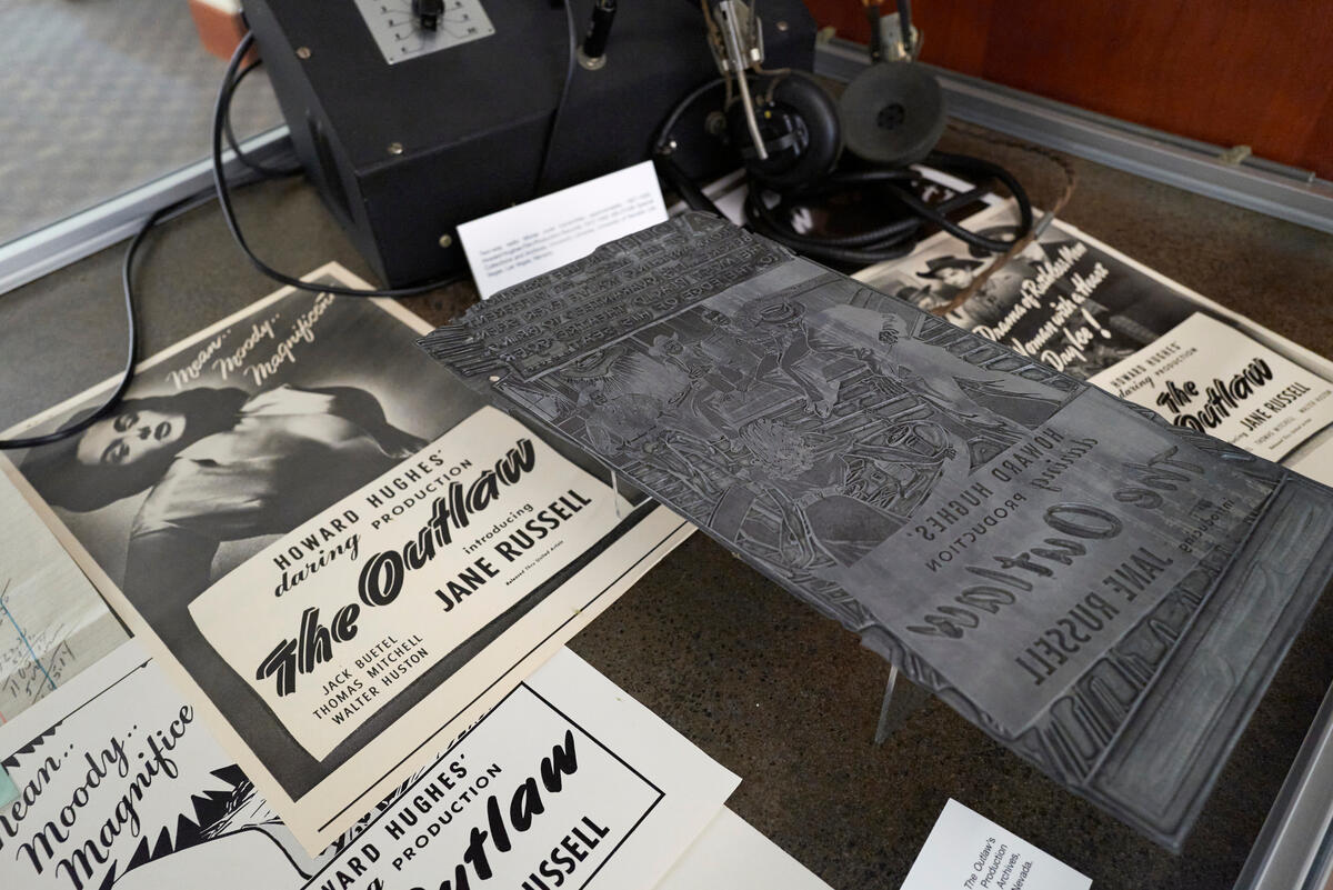 Advertisements for The Outlaw on display as part of the "Script to Screen" exhibit in Lied Library.