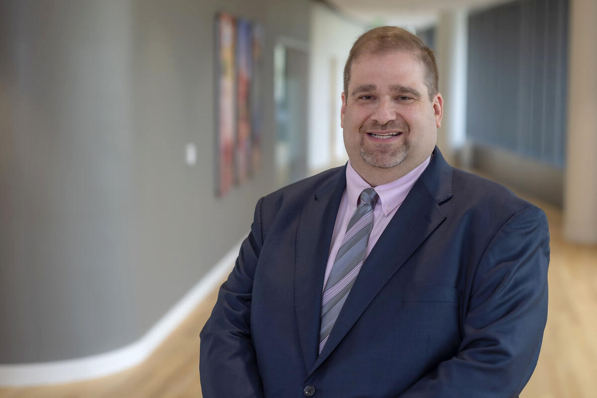 man in suit posing in hallway