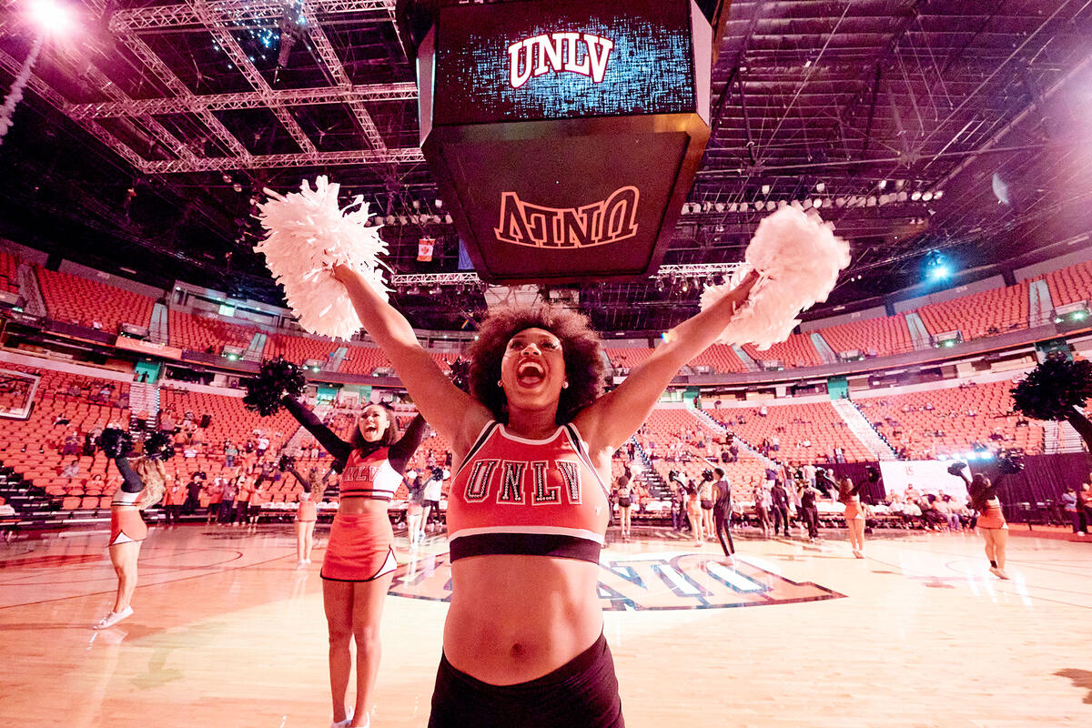 UNLV Cheerleaders on the floor dancing at the Thomas and Mack Center