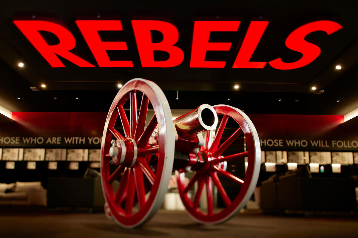 replica cannon with signage above saying "Rebels"