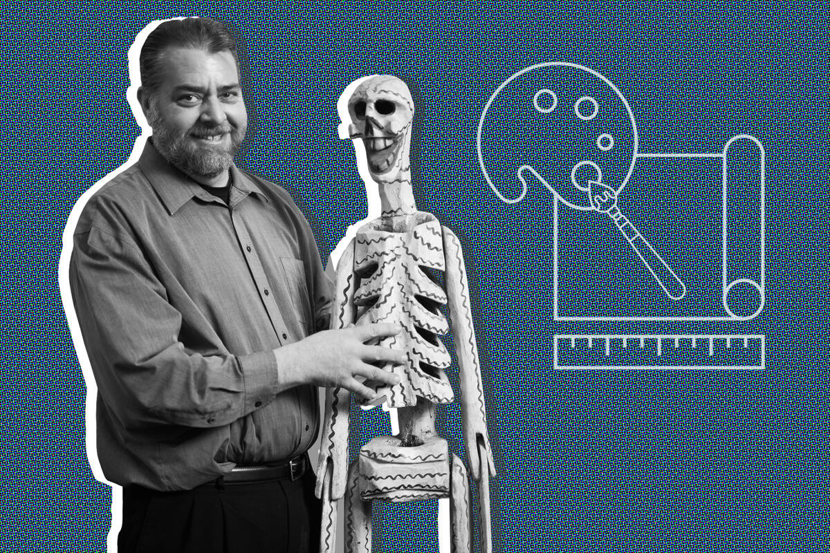photo of illustration of man holding skeleton prop