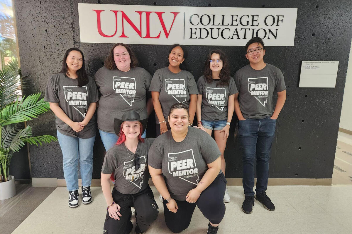 A group picture with the seven P.A.L.S. program staff members in front of a sign that reads &quot;UNLV&quot; College of Education