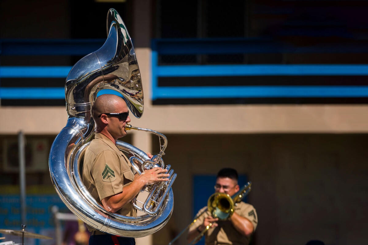 marine playing a tuba in military band