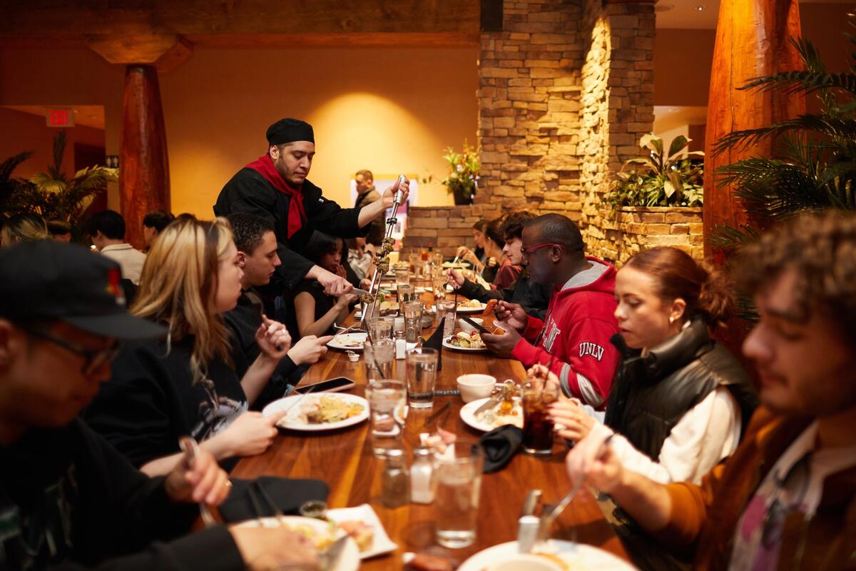 Students eating Brazilian churrasco at Pampas on the Las Vegas Strip.