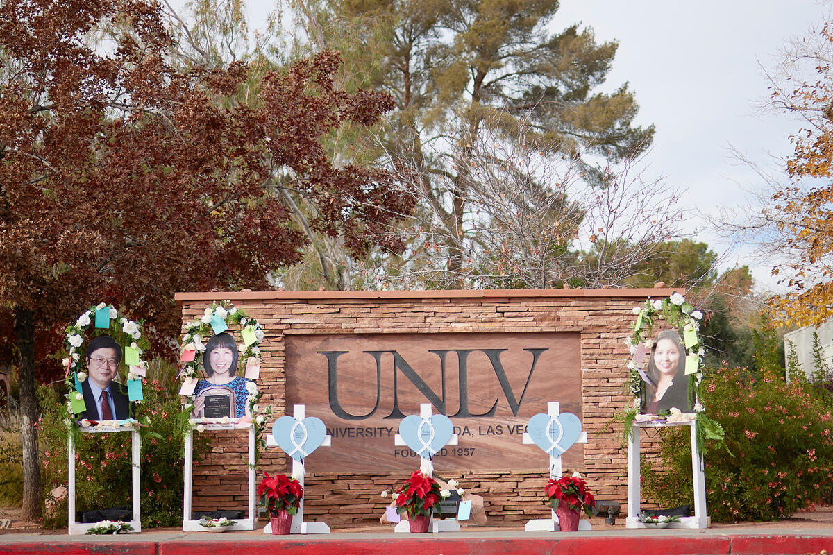 Vigil at a UNLV sign for the three professors that passed during the December 6 shooting