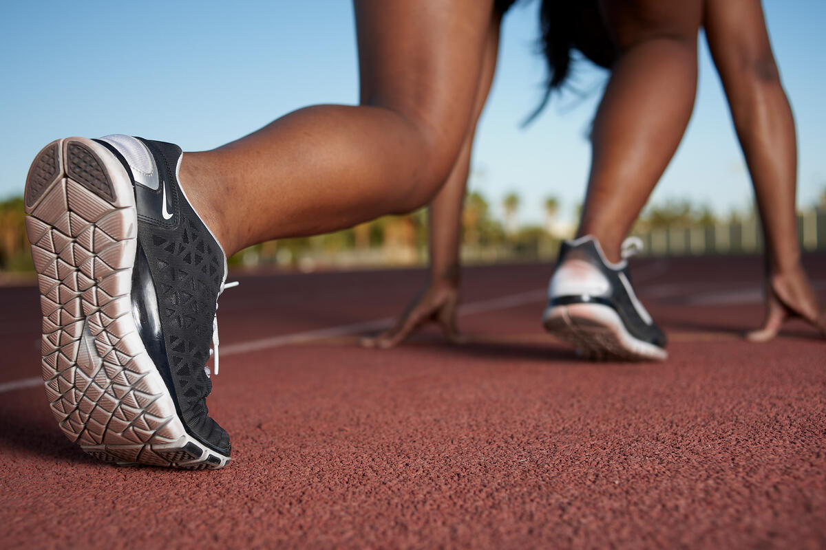 close up of athlete preparing to run on track