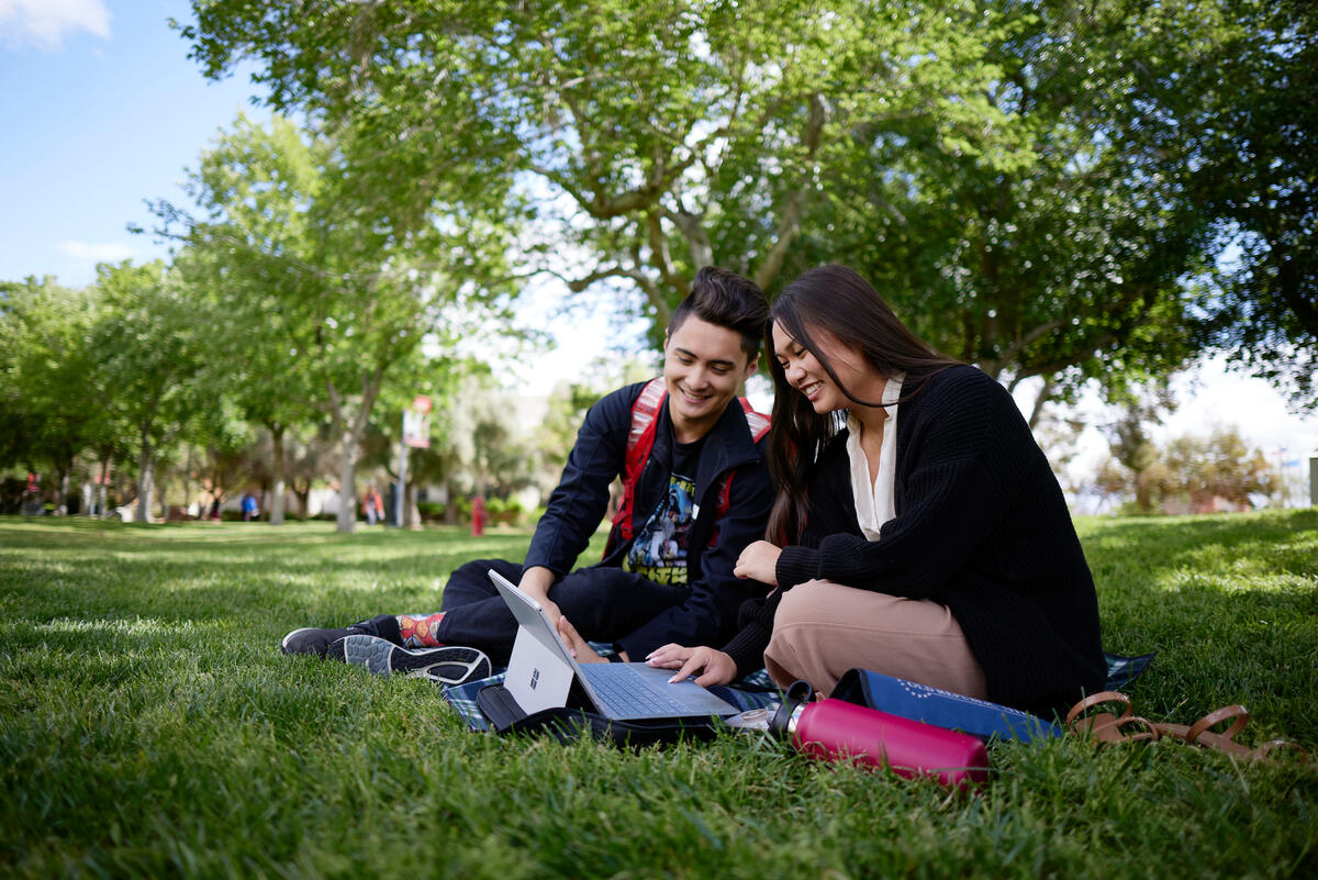UNLV students studying outdoors on campus