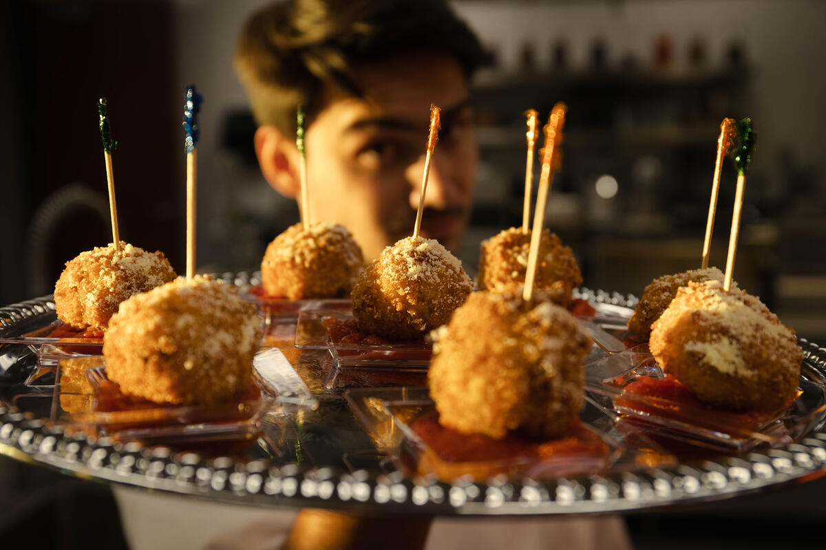 Picture of a person holding a plate of food