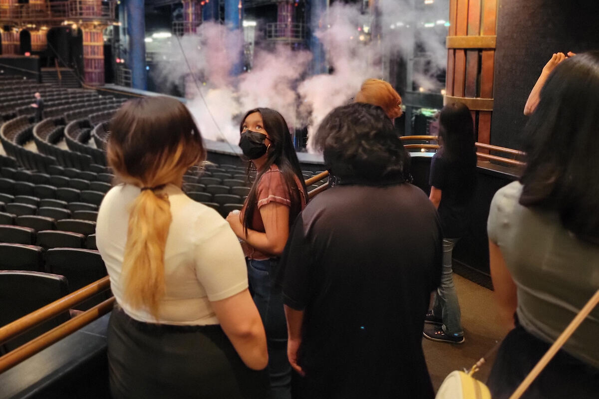 People looking around a theater