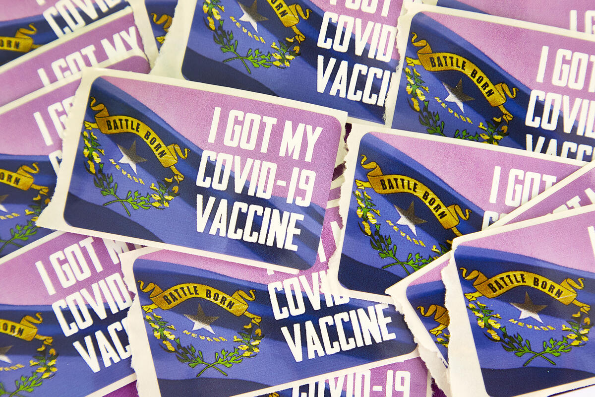 scattered stickers with words 'I GOT MY COVID-19 VACCINE'