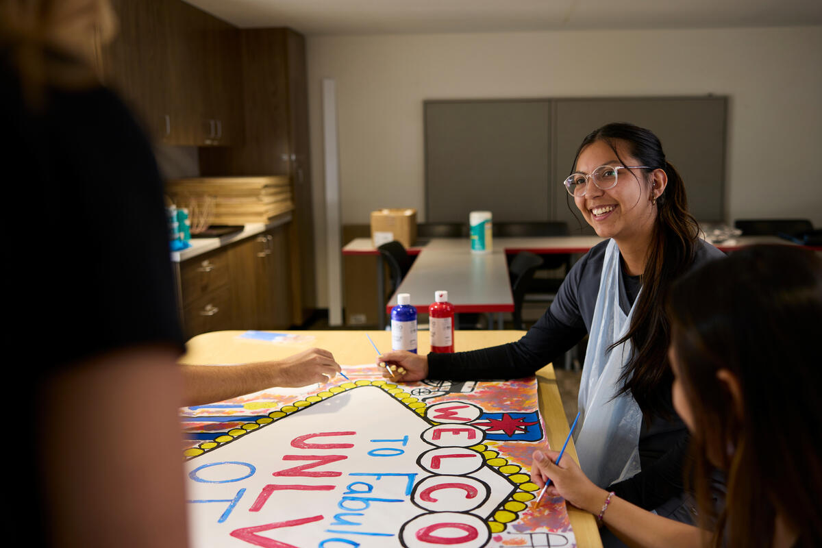 Occupation therapy student receiving instruction for painting hand movements.