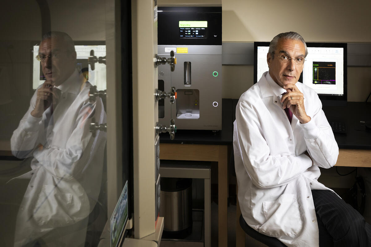 Photo of a person wearing a lab coat in a lab