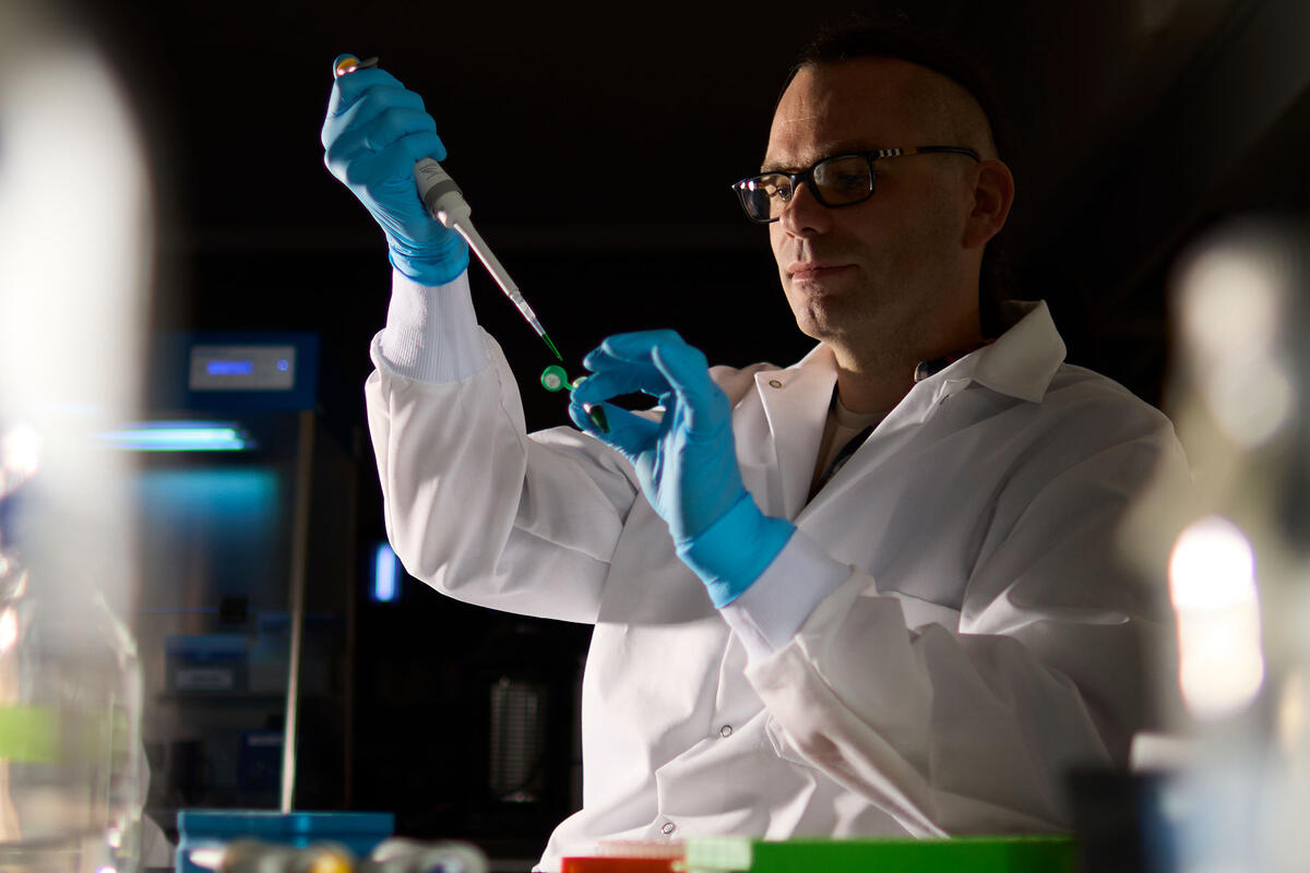 Photo of Lukasz Szajder in a lab