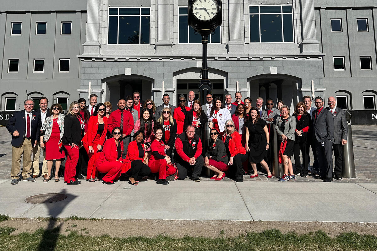A group of people in front of a building