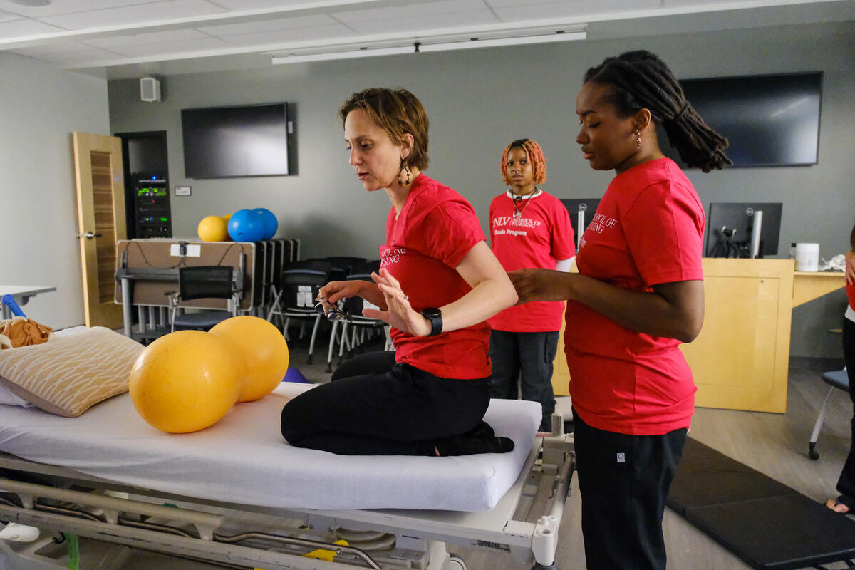 Three people in a classroom