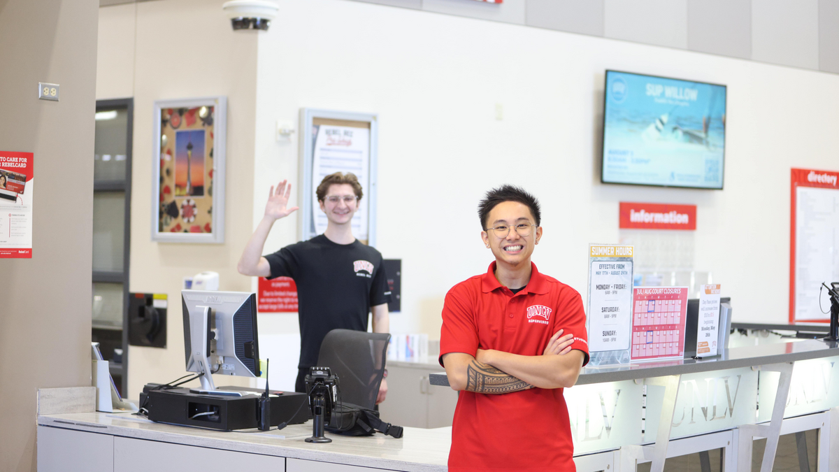 Student employees standing by the UNLV service desk