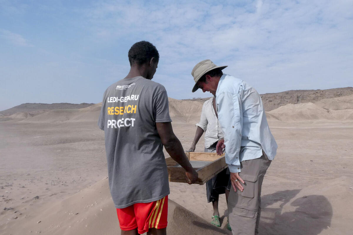 UNLV professor Brian Villmoare (right, in blue shirt) working at the Ledi-Geraru research site.