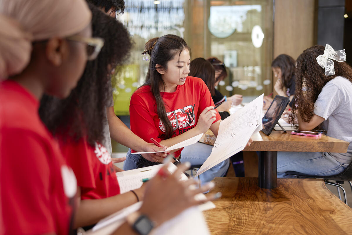 a person teaching something on paper