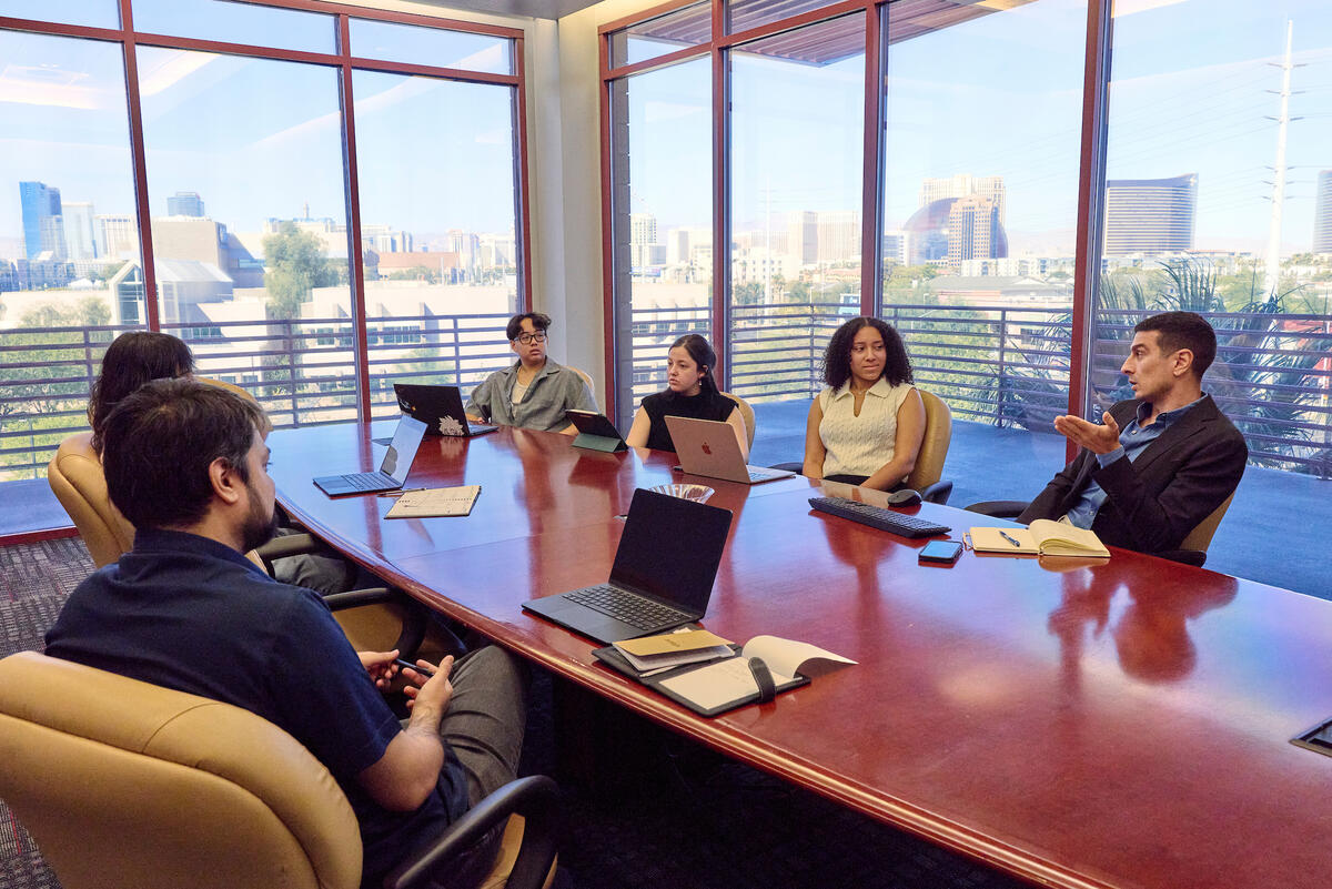 Kasra Ghaharian and students involved in State of AI report