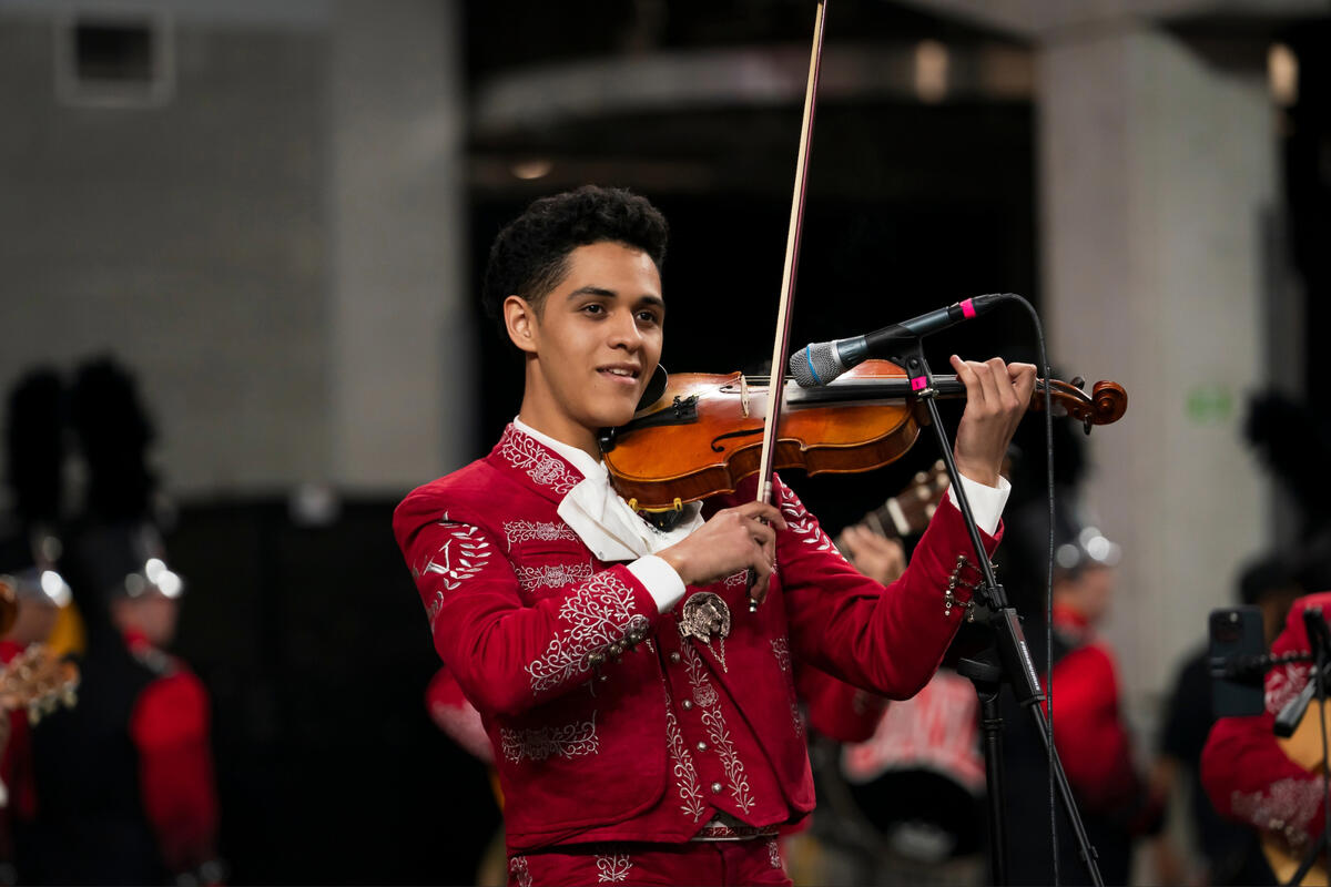 Axel Rodriguez Olivas plays the violin in a mariachi ensemble at Allegiant Stadium.