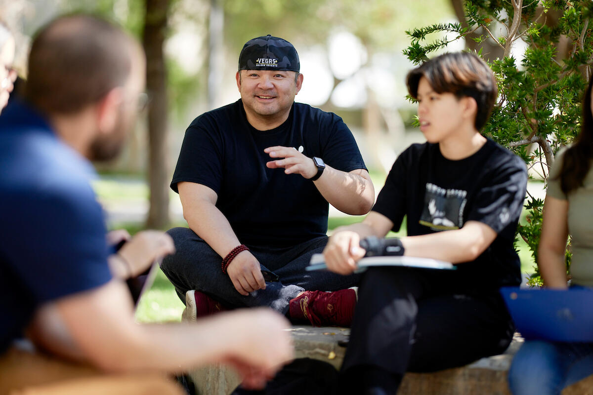 people sitting outside in a circle