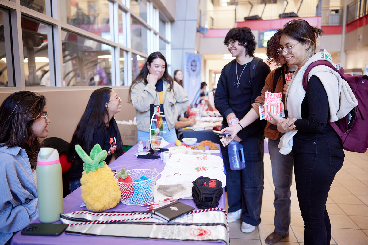 Students tabling inside of the Student Recreation & Wellness Center.