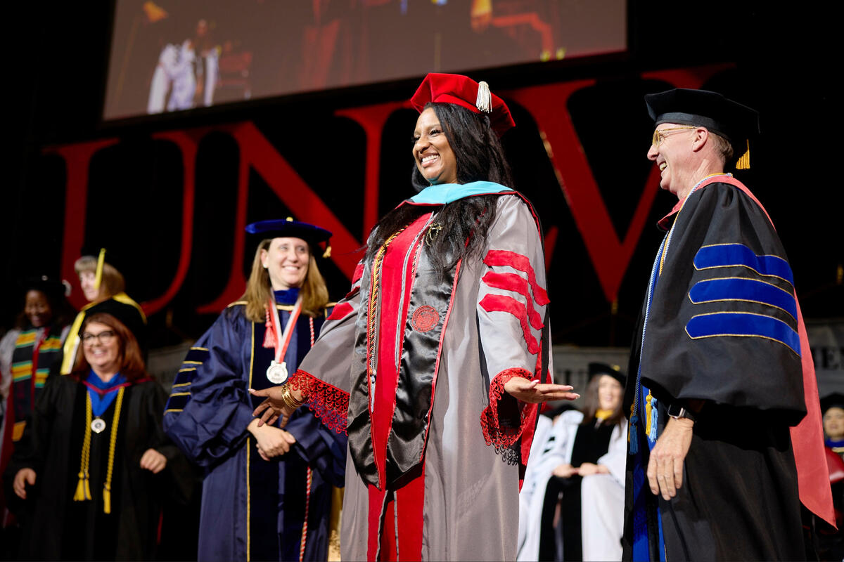 Ashley Pruitt graduates with a Doctorate of Public Policy at commencement.