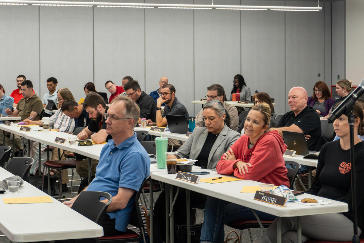 A group of people sitting in different tables