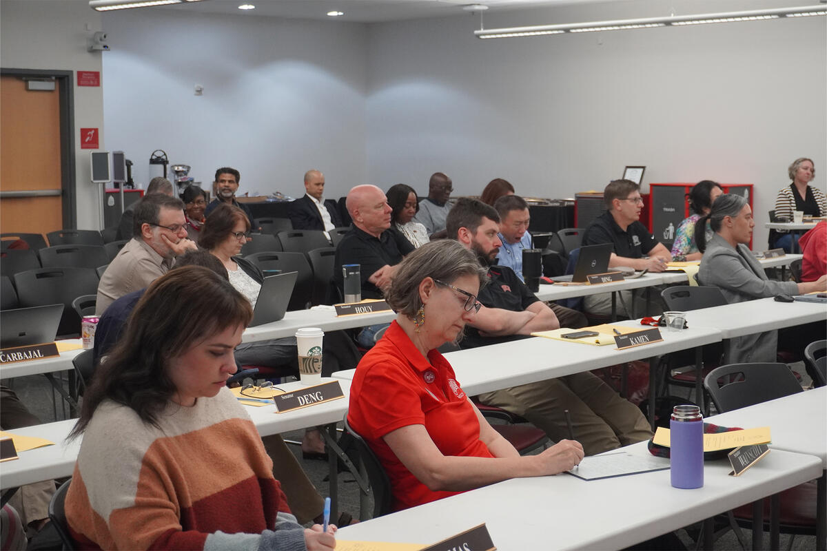 Members gathering for a Faculty Senate meeting