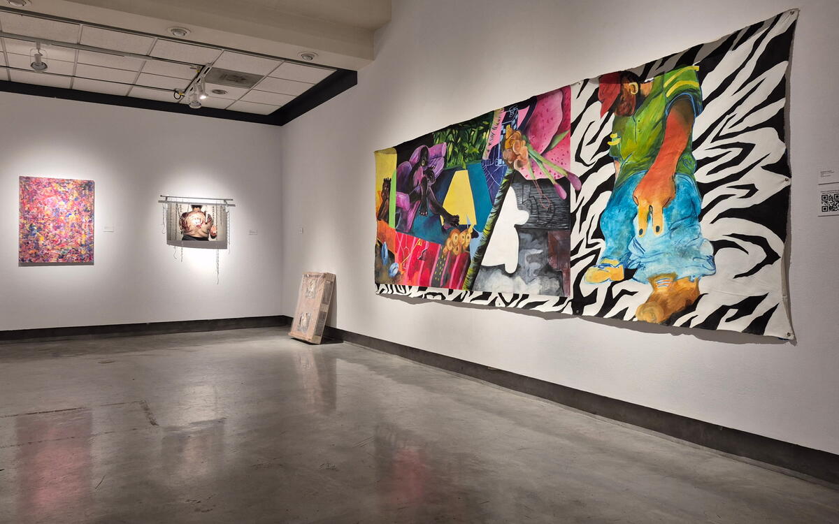 Art Display with paintings on the walls in a corner