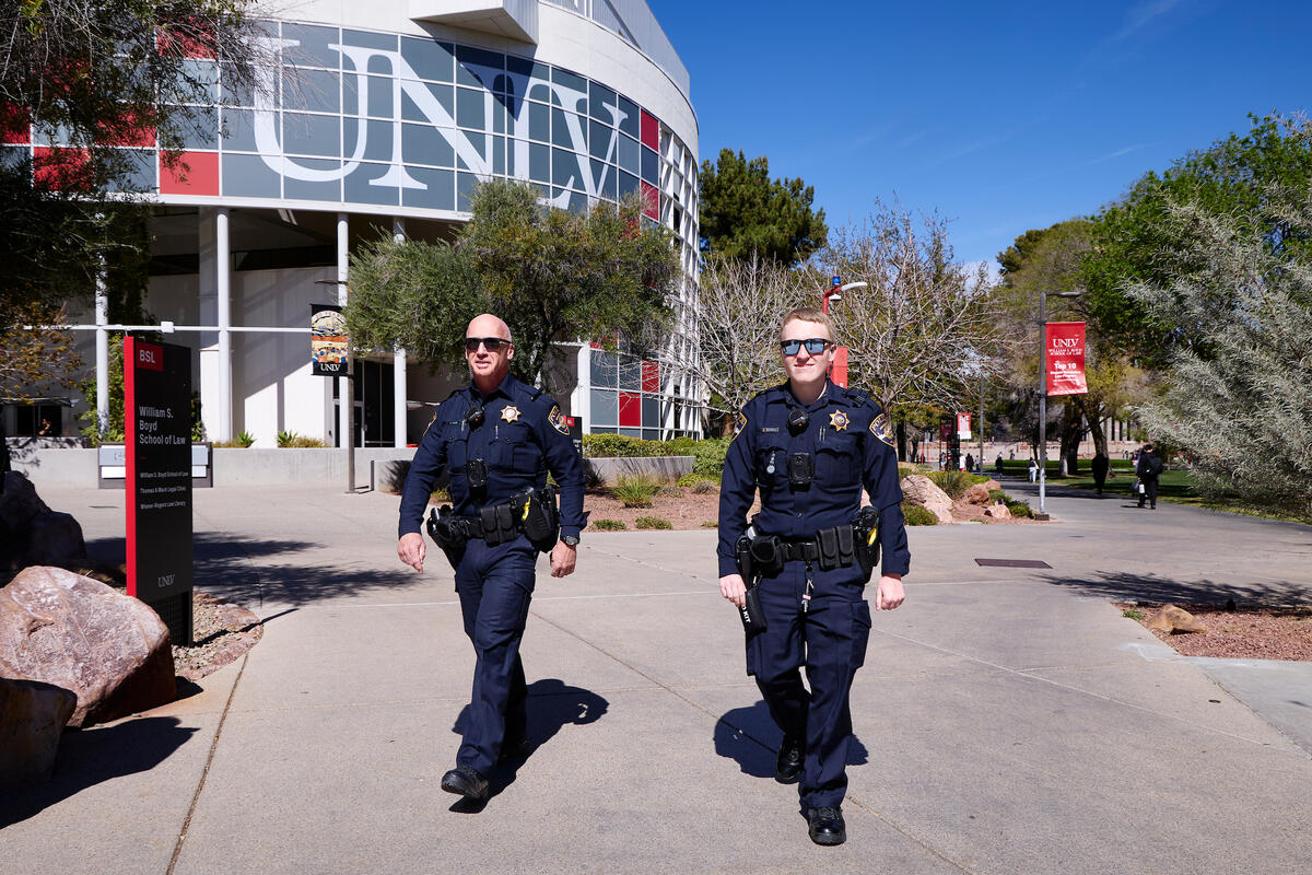 University police officers walking outside on UNLV campus