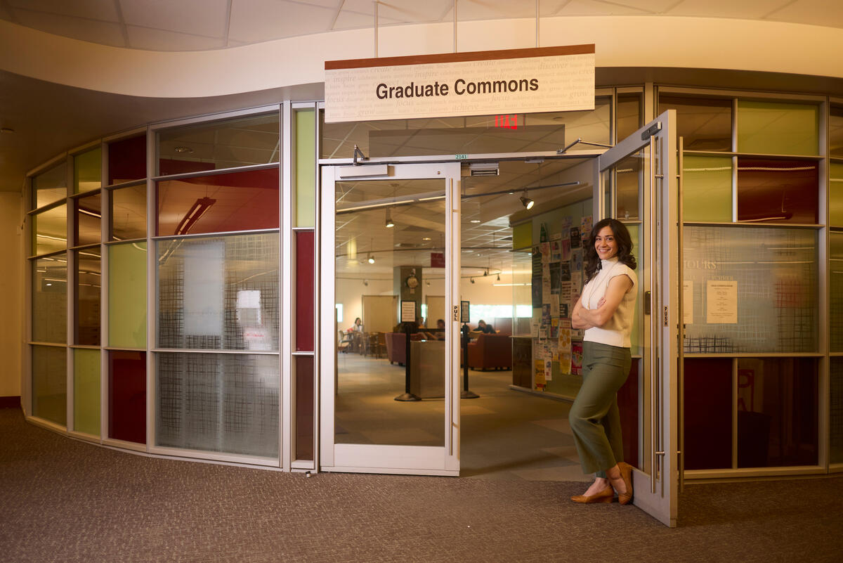 Virginia Smercina stands at entrance of Graduate Commons